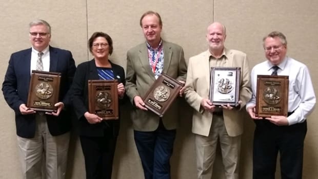 Accepting plaques for 2020 Numismatic Ambassador honors are (from left) David Crenshaw, Kim Kiick, Mark Anderson accepting on behalf of David Menchell, Scott E. Douglas and Patrick A. Heller. (Photo courtesy Dave Harper.)