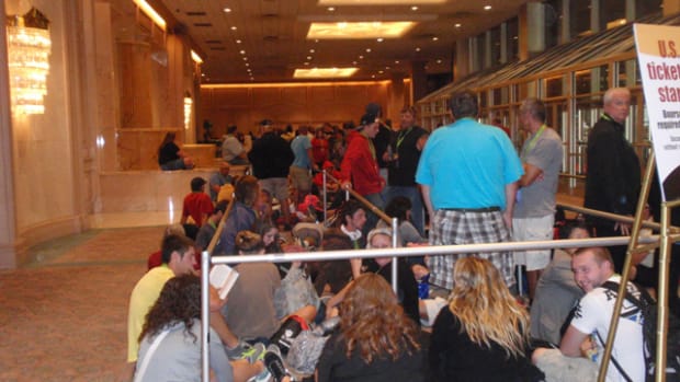 Inside, it looks like a line for airport security as ticket holders wait for a chance to buy gold Kennedy half dollars.
