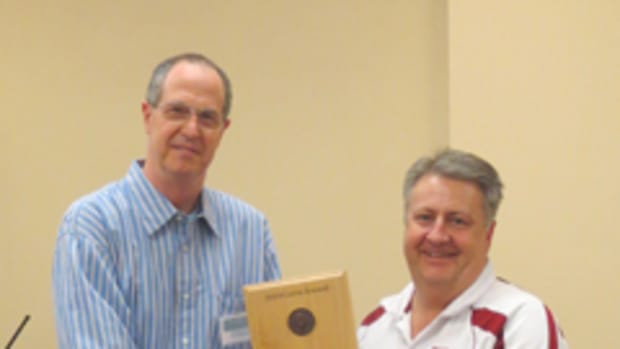 Bob Campbell (right) receives the 2014 James J. Curto Award from Tony Chibbaro on at the National Token Collectors Association  Annual Token Show in Omaha.