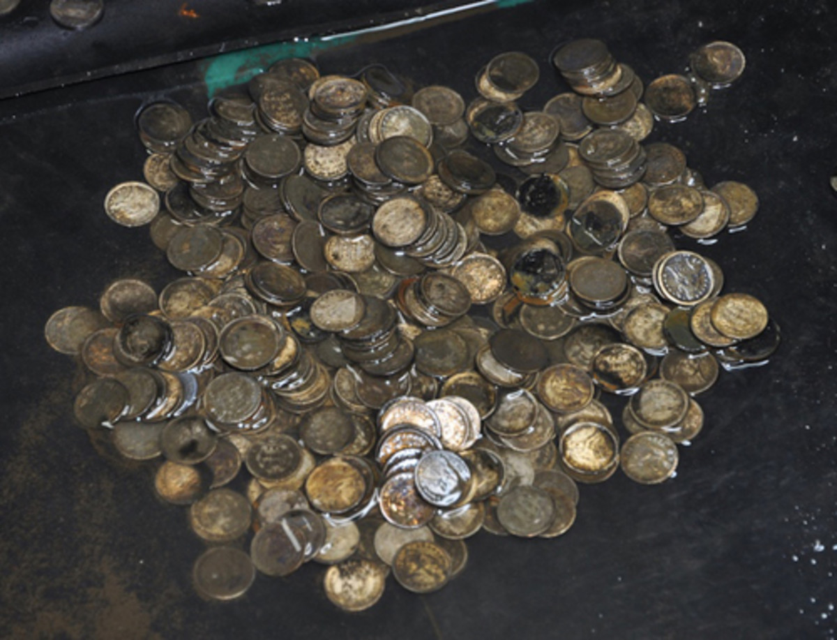  This photo taken in 2014 shows some of the more than 8,000 U.S. dimes, still wet from the bottom of the Atlantic Ocean, just after they were recovered from a safe on the 'S.S. Central America' that sank in 1857. (Photo courtesy of California Gold Marketing Group)
