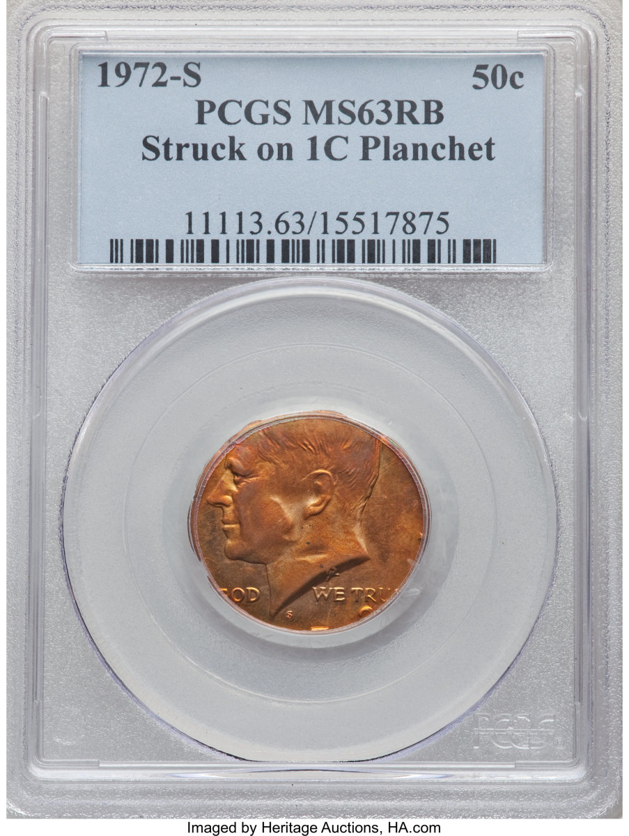 1972-S 50C Kennedy Half dollar, but struck on a cent planchet.  The result is a scarce and desirable off-metal combination, much rarer than cents struck on dime planchets. This fire-red mint error has a bold mintmark. Much of the date is absent, but the top of the 7 and 2 are prominent. The centering favors Kennedy’s profile. LIBERTY and (appropriately) the denomination are absent. The central reverse is softly struck.  The winner paid $7,500. (Image courtesy of Heritage Auctions)