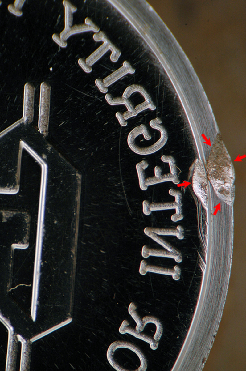 This is a rim damaged die from a private mint. Pieces struck with it will also show damage as the reverse proof dime does.
