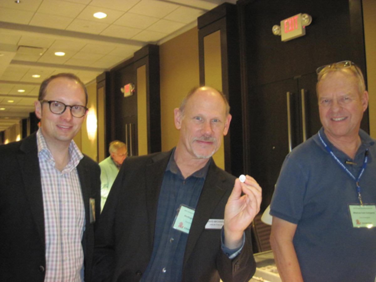 David Michaels (center) of Heritage holds a silver Athenian coin from before 500 B.C.E. (closeup at left) at CICF. He’s accompanied by Ulrich Kuenker (left) of Germany and Cory Frampton of Mexican Coin Company.