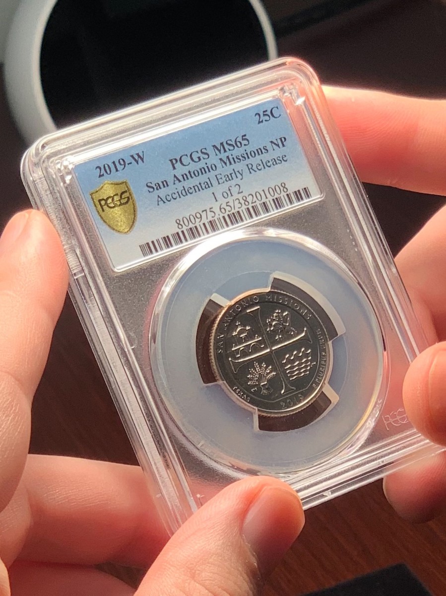 Steve Feltner, PCGS director of numismatic education and outreach, holds one of the two Accidental Early Release 2019-W San Antonio quarters. (Photo credit: PCGS.)