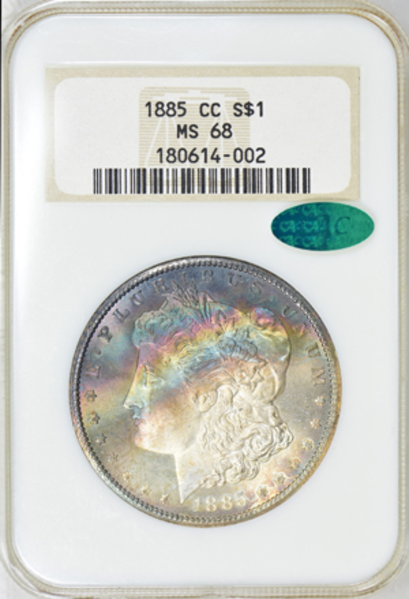 1885-CC Morgan dollar graded MS-68 with crescent toning in original NGC holder.