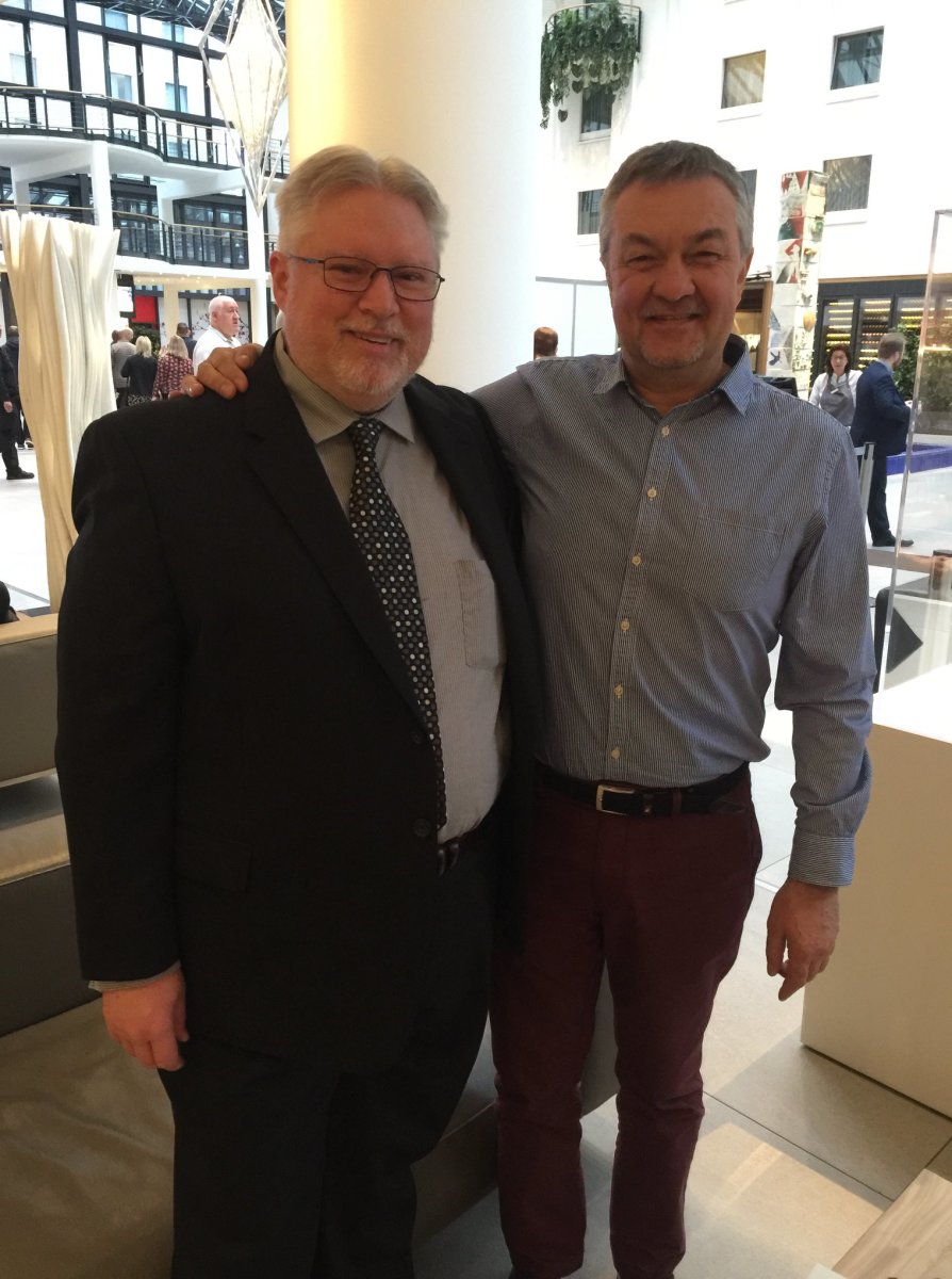 Senior Editor Tom Michael (left) meets with Almat Bassenov, a designer for the National Bank of Kazakhstan on-site at the World Money Fair in Berlin, Germany.