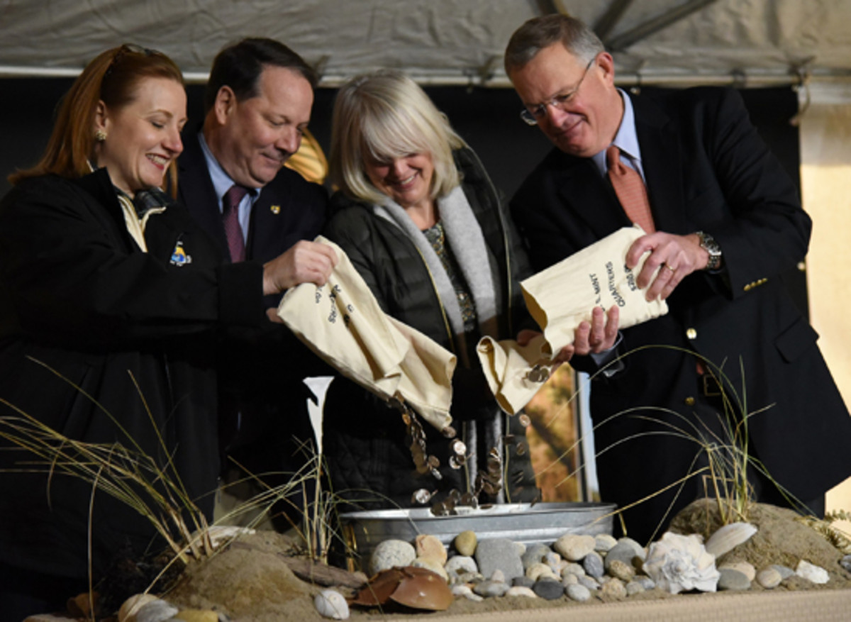  From left, the four participants in the traditional coin pour at the debut of the Block Island quarter were Margaret Everson, Principal Deputy Director, U.S. Fish and Wildlife Service; James Kurth, Deputy Director, U.S. Fish and Wildlife Service; Janet Coit, director of the Rhode Island Department of Environmental Management; and David J. Ryder, Director of the United States Mint. (U.S. Miint photo)
