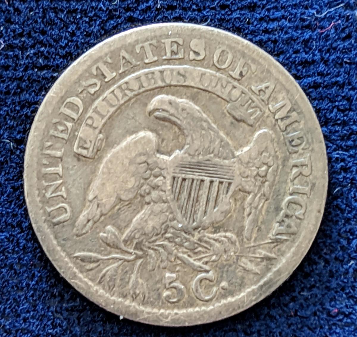 Reverse of an 1834 half dime with 5c on reverse. Images courtesy of USAcoinbook.com
