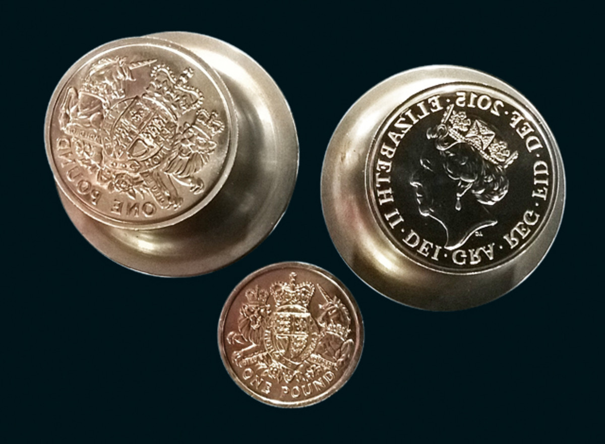 The working dies used to strike Britain’s last circulating round pound shown below. Image courtesy and © The Royal Mint.