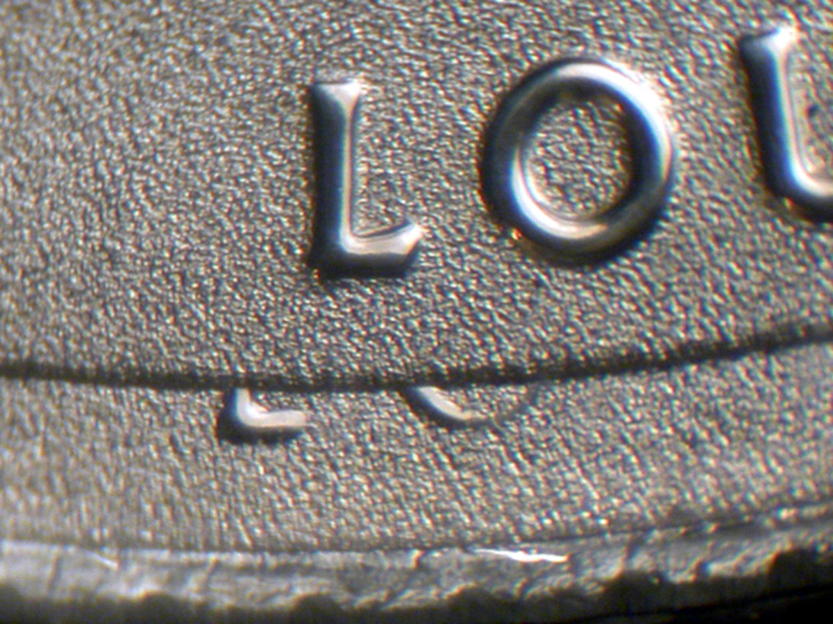 The letters may look raised, but they are actually incuse (recessed) on the Kisatchie quarter.