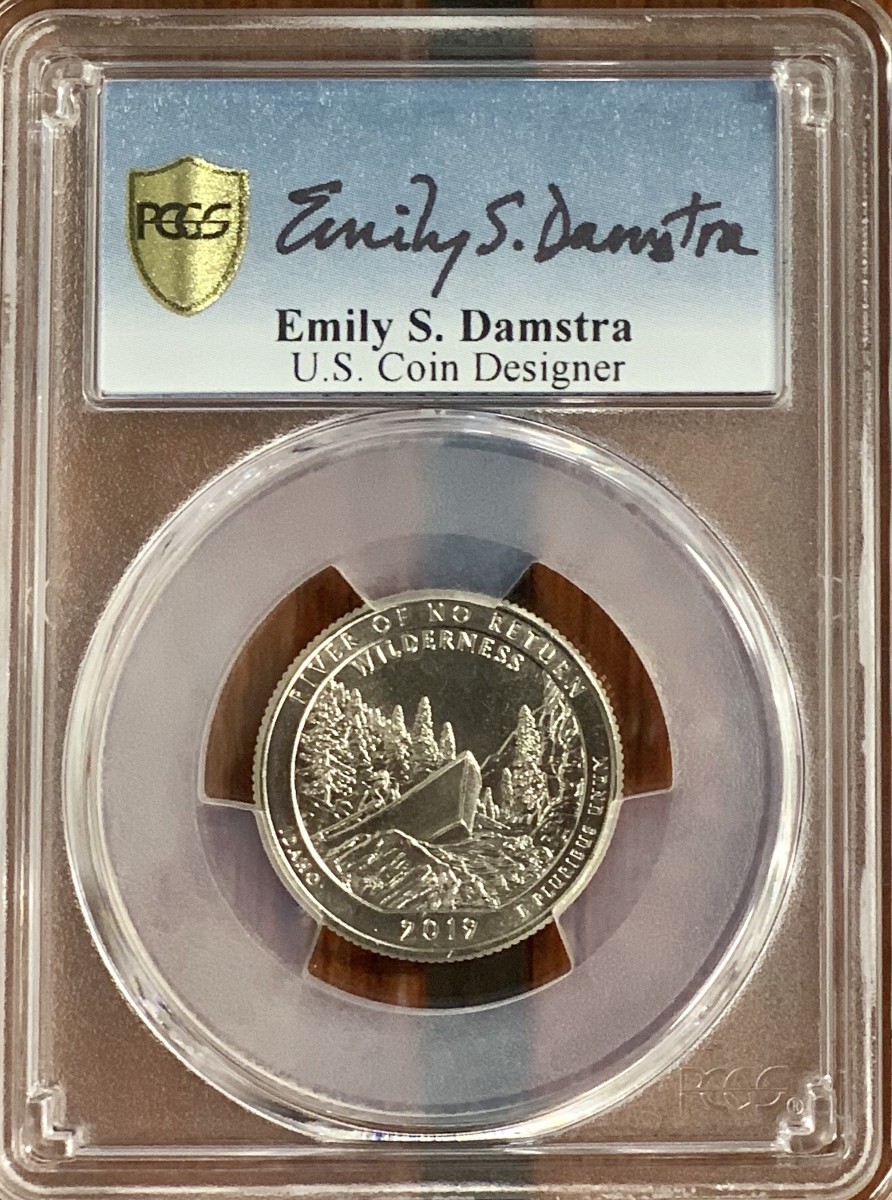 PCGS Collectors Club members and Authorized Dealers have an opportunity to get encapsulation inserts hand-signed by artist Emily Damstra for coins she designed. (Photo credit: Professional Coin Grading Service www.PCGS.com.)