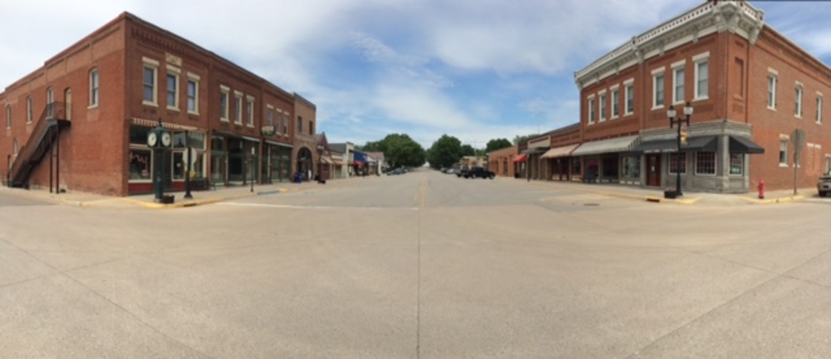  This modern view of Main Street in Conrad, Iowa, shows both the national bank, at left, and the old Conrad State Bank, on the right. Very little has changed since the early views, making Main Street in Conrad a true historical delight.