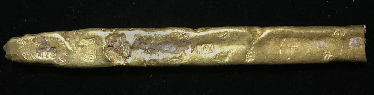 This gold “finger” bar recovered from the Atocha was used as a means of transporting great wealth and bears several tax stamps indicating that King Philip IV’s share had been paid.