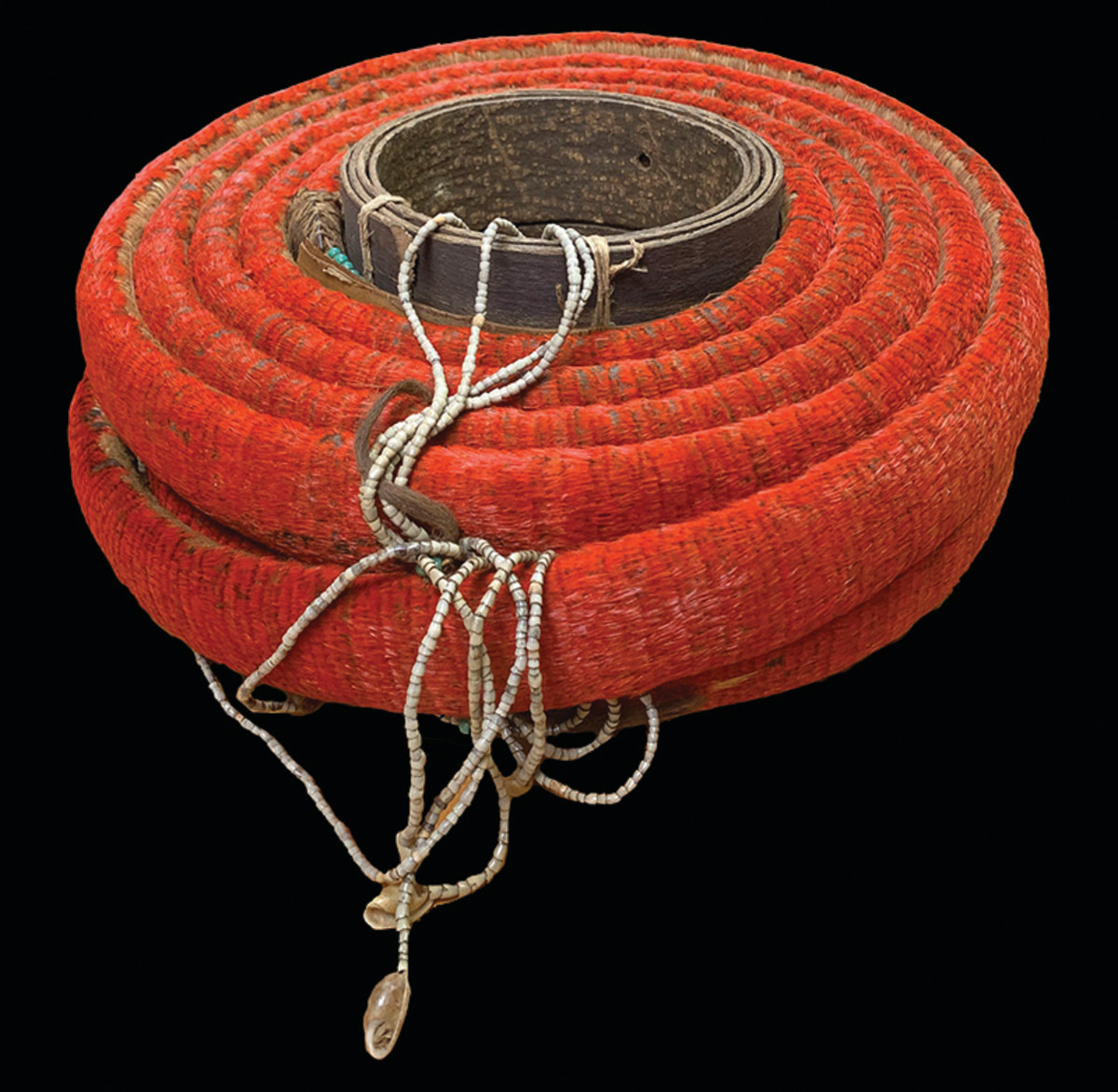 SOLOMON ISLANDS: Santa Cruz Islands, feather coil money (3519g), 19th to early 20th century, Opitz p.142-43, Knox p.50, ca. 8.17m (26'-9½") long and 5cm wide (2"), rolled into a 5-layered double-row coil ca. 35cm in diameter (14"), fully intact and covered in scarlet feathers, decorated with strings of coix seed money and shells, a first-grade example (#1) in the traditional 10-tiered system and a superb specimen, Unc, RRR, ex Charles Opitz Collection.  Estimated at $4,000-$6,000. Realized $18,000.