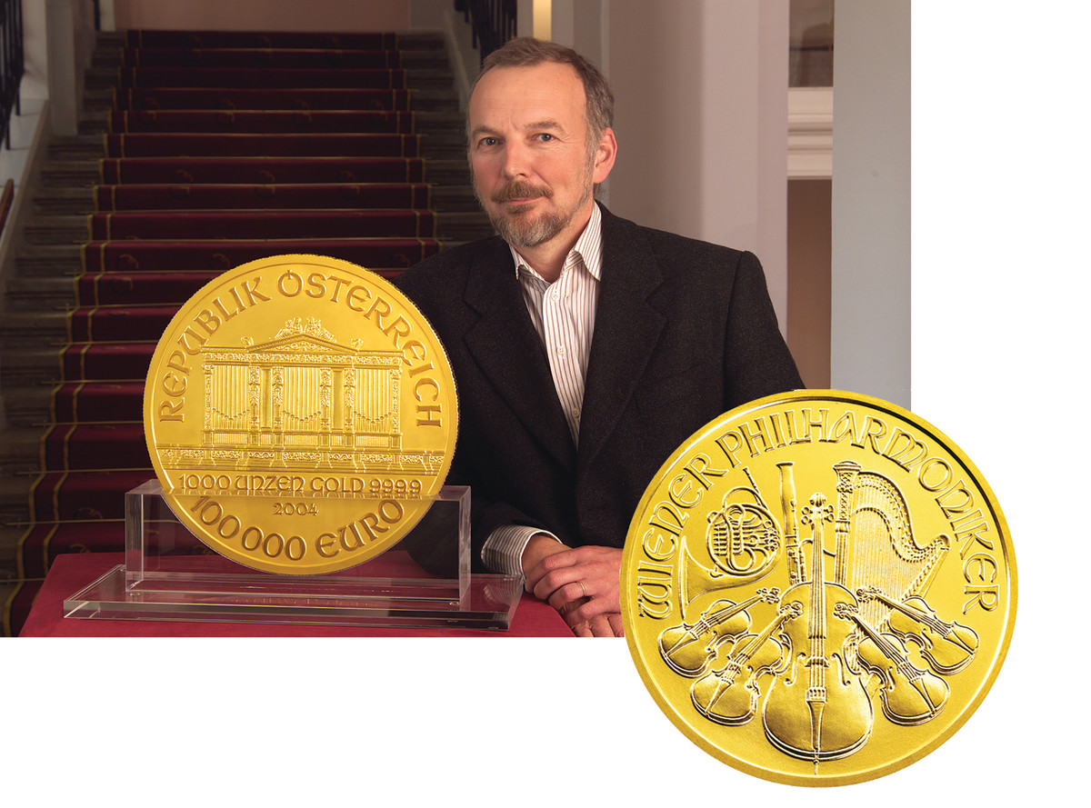 Pesendorfer’s iconic Vienna Philharmonic Orchestra design has been used on quite a number of bullion pieces from Austria. He stands here next to the largest version, a 100,000 Euro 1,000 ounce gold coin produced in 2004.