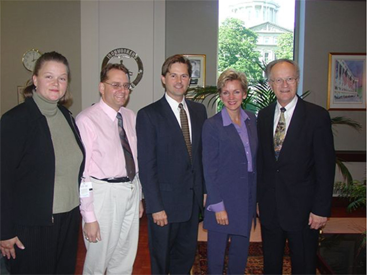 Michigan’s only living designer of a United States coin is Steven Bieda of Warren, Mich. (center). He designed the reverse of the 1992 Olympic half dollar. Bieda (D) was a member of the Michigan House of Representatives (and is now a state senator) and is the only designer of a U.S. coin ever elected to state or federal office. This photograph was taken on Sept. 30, 2003, at the meeting where Governor Jennifer Granholm selected the final design for the Michigan quarter. Participants in the historic meeting included (from left) Sarah Lapshan (Department of History, Arts, and Libraries and the governor’s liaison with the U.S. Mint), Patrick A. Heller (Liberty Coin Service and Michigan Quarter Commission), Rep. Bieda, Governor Granholm and Dr. Anderson (Department of History, Arts, and Libraries).