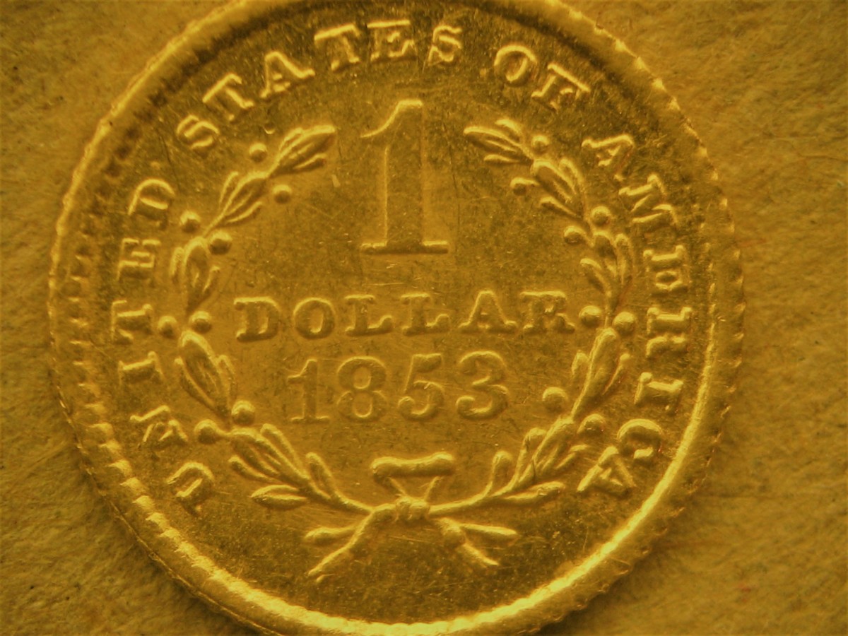 Fig. 1: Decades-old counterfeit with low relief “mushy” design.