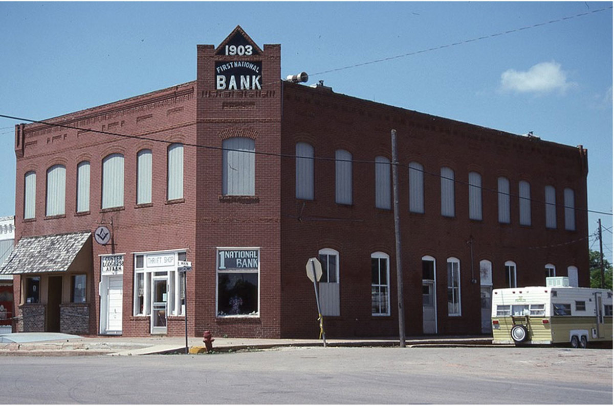 The Custer City Commercial Building, 423 Main Street, built in 1903, housed The First National Bank of Custer City. It is apparent that The First National Bank was a successor to a bank with a territorial charter at this location dating from 1903 that was nationalized in 1907. The bank used this location until 1976. Fred Wiemer photo, Oklahoma State Historic Preservation Office. 