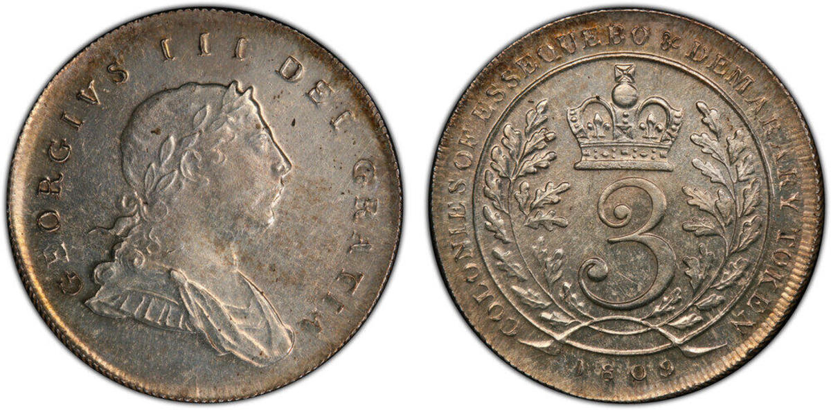 LOT 1556 ESSEQUIBO & DEMARARY: George III, 1760-1820, AR 3 guilders, 1809, KM-8, Prid-4, edge grained left, nicely detailed despite the shallow-strike that is standard for this type, much original mint bloom present, PCGS graded MS62, R Estimate: $5,500-$6,500