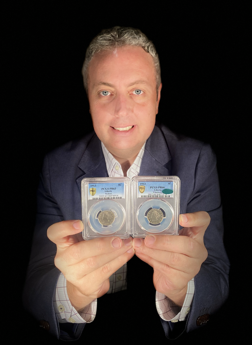 Ian Russell, president of GreatCollections, holds two multi-million-dollar U.S. 1913 Liberty Head nickels that he has purchased in the past year, including the one on the left he just acquired from a Florida family for $4.2 million. Only five 1913-dated Liberty Head nickels are known.