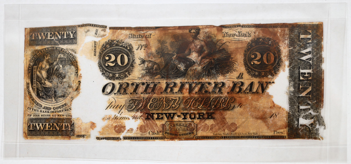North River Bank, NY, $20: This $20 note, Haxby G50c, issued by the North River Bank of New York was recovered from Purser’s safe found on the Atlantic Ocean seabed where the S.S. Central America sank in 1857. (Photo courtesy of Holabird Western Americana Collections.)