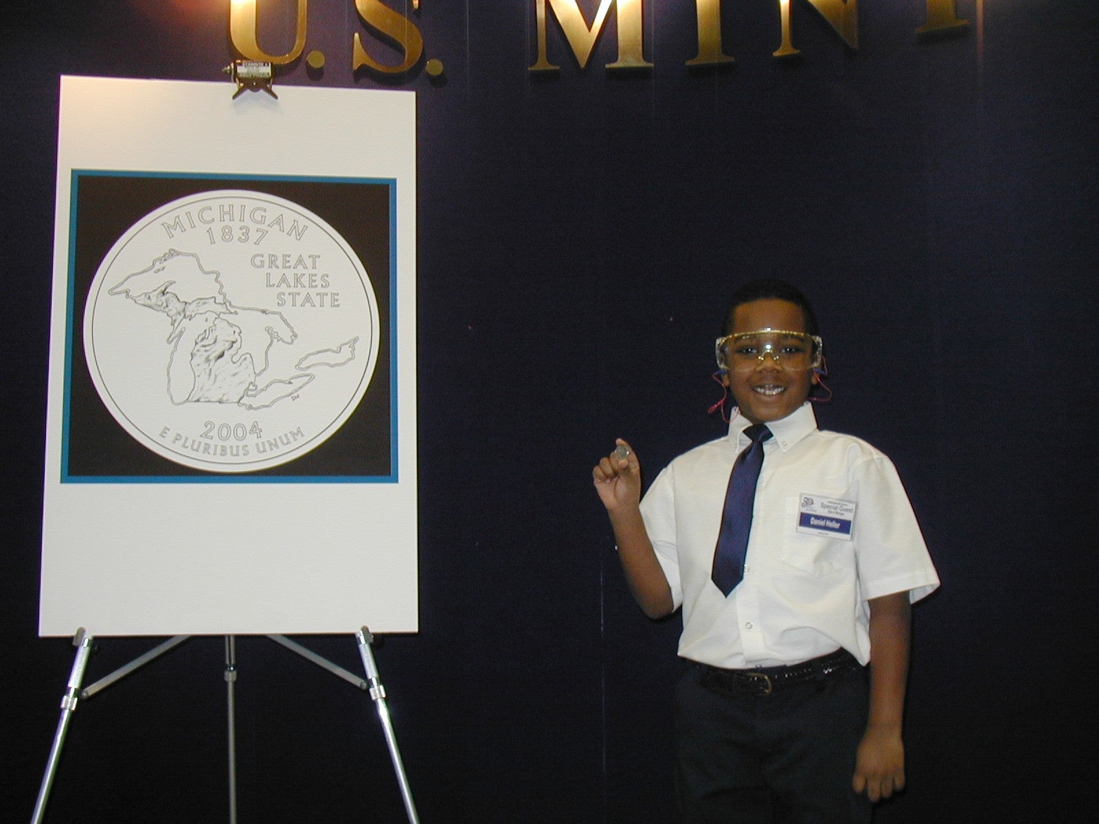 20040108-daniel-holding-quarter-2.jpg